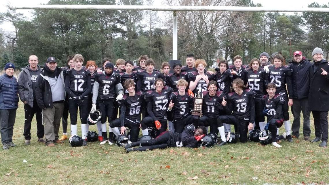 Littleside football goes undefeated to win championship